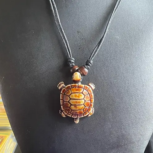 Adjustable black rope turtle necklace
