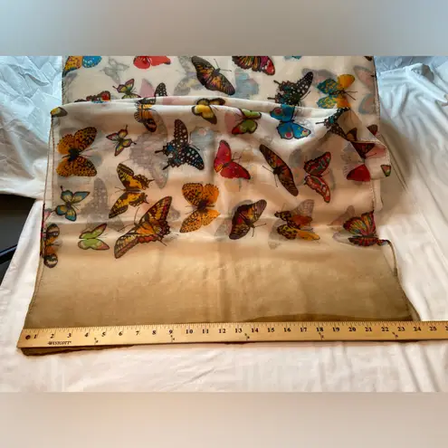 Scarf with Butterfly’s roaming! Feels like cotton blend. Sheer. Lightweight