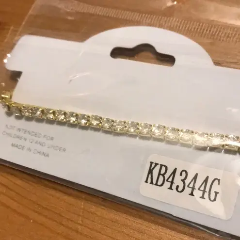 GOLD TONE CLEAR RHINESTONE STRETCH BRACELET