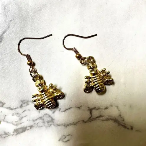 Gold tone and black bee earrings
