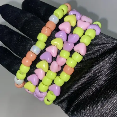 Set of 7 beaded bracelets, vibrant colors. Perfect for gifting or givys. Purple