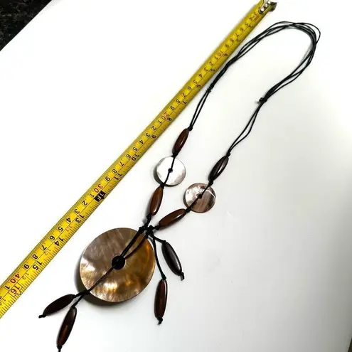 Long circle shell brown beaded necklace on adjustable cord