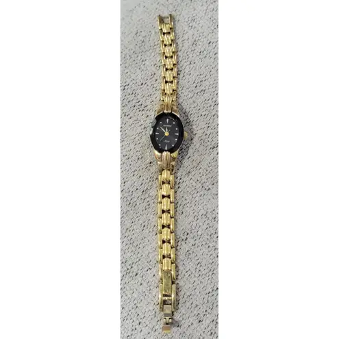 Armitron Now Gold Tone Ladies Watch Black Dial Oval Face Stainless Steel