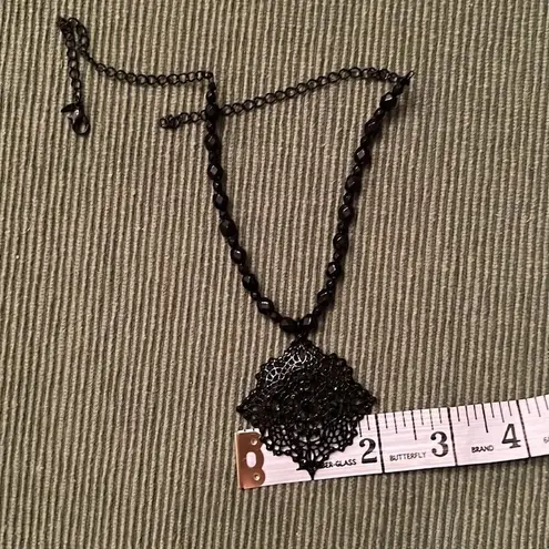 3 necklaces in black, black and gold, black and white colored EUC