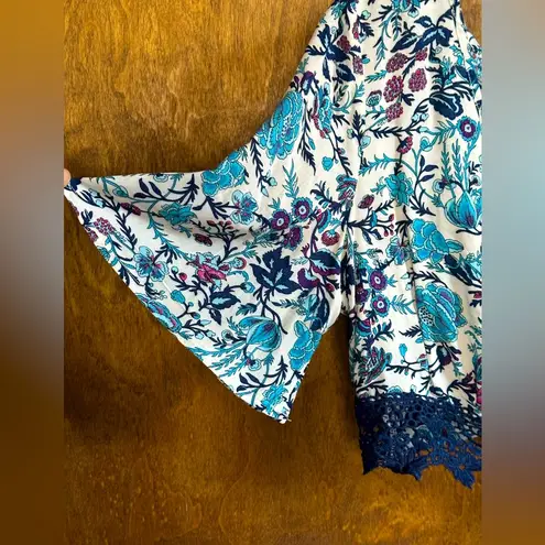 Solitaire swim (L) floral crop top, bell sleeves, lace, ties in back