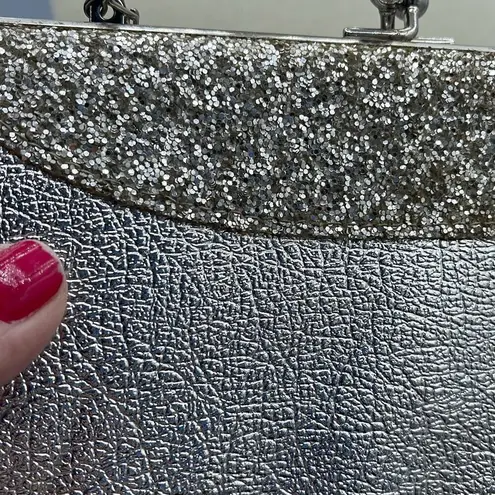 Vintage mid century silver foil clutch with silver cut stones .