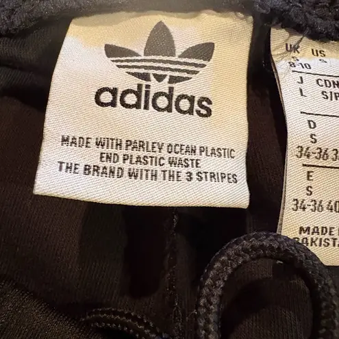 Adidas  track pants white stripes and a slim tapered leg women’s S long