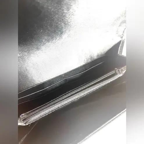 Tribal print and black small clutch black with tassel on the zipper snap closure