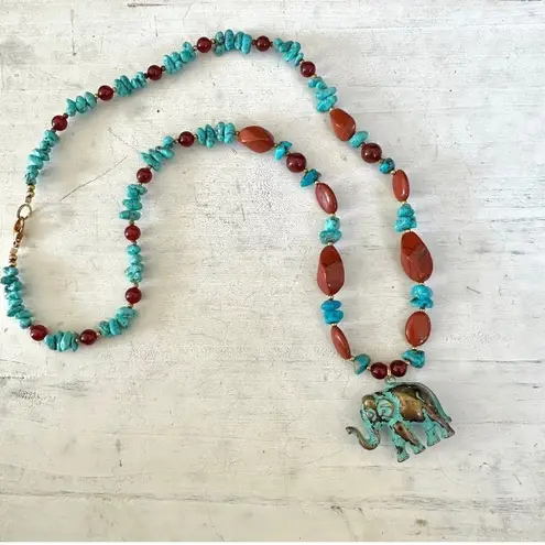 Brass elephant pendant necklace with carnelian, turquoise and red jasper beads