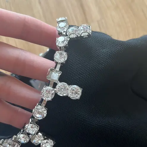 Area black asymmetrical jumpsuit with crystal embellishment