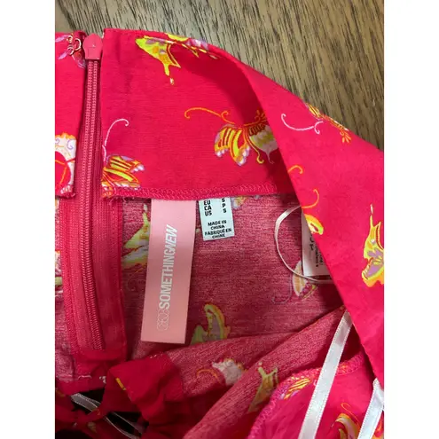 Something New halter neck cropped top in pink butterfly print. Size S. NWOT