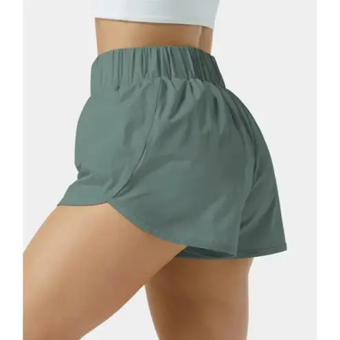 Halara  High Waisted Dolphin Hem Shorts Green Size L NWT