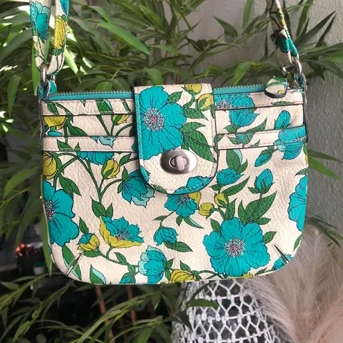 Floral crossbody bag with a white green blue design