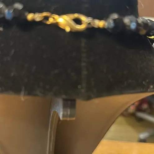 Beautiful vintage necklace. The seed beads are glass. rest of the beads plastic.