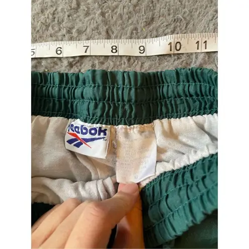 Reebok  vintage women’s green nylon sweat pants size medium