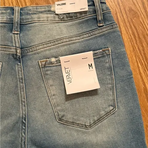 Vervet medium Valerie Bermuda length distressed denim shorts. Blue