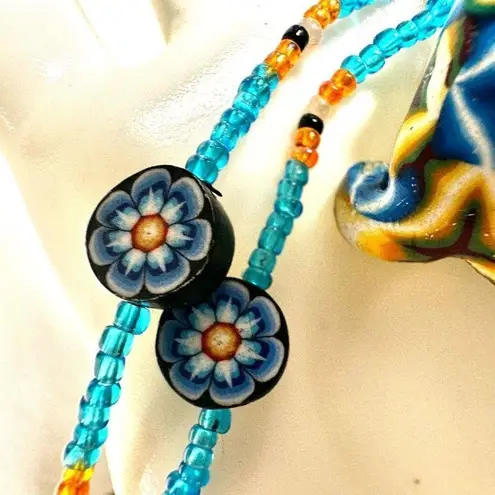 Beaded blue frog pendant necklace