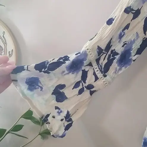 B. Original Blue Floral Lace Up Romper size small