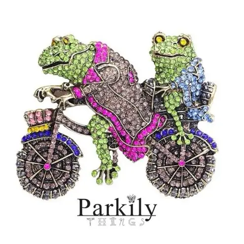 Brooch pin of two frogs riding a motorcycle adorned with sparkly crystals Gold