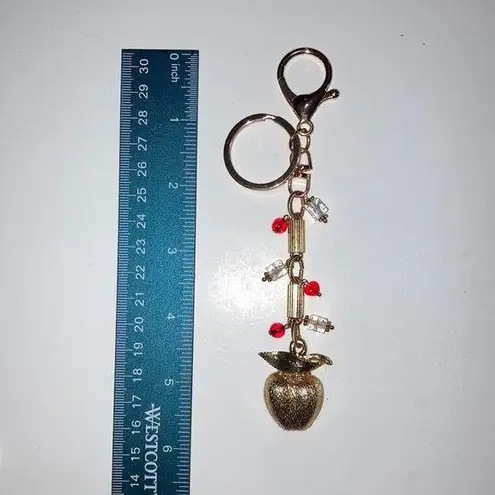 One of a kind (OOAK) gold tone bag charm with key ring