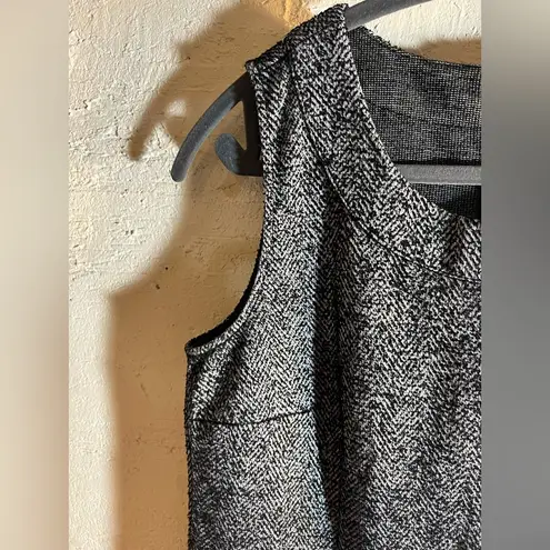 CAbi  tweed top size Small, sleeveless , zipper back—beautiful zip pocket front