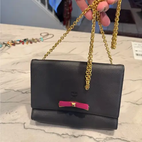 MCM Visetos Mina Crossbody Bag Dark Grey with a Pink Bow Accent