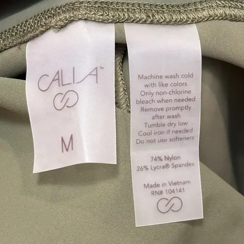 Calia Sculpt Vented Straight Dark Olive Cropped Pants Womens NWT Size Medium Green