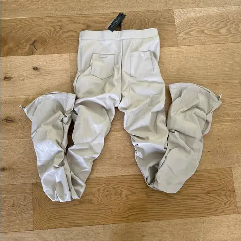 Maniere De Voir - Tacked Faux Leather Flared Trousers in Beige