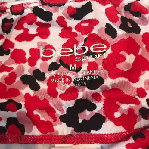 Bebe  Red Pink Black and White Floral Capri. Size Medium. EUC