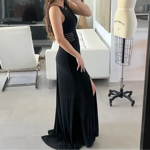 Women size small long black dress with small train bust and waist mesh detail