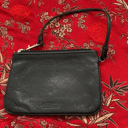 Fossil  | leather wristlet with zip closure. Simple, compact and stylish.