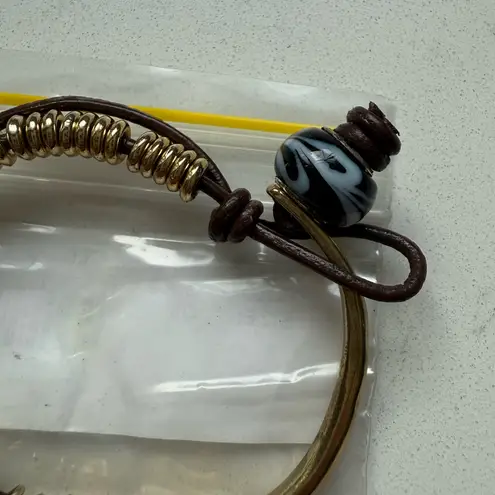 Bansri Lucky Charm Bracelet Gold Coil Leather Elephant, Wishbone & Tusk Pendant Brown