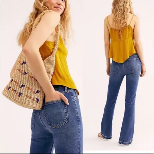 Free People  • high rise button fly released raw hem slit emmy jeans sz 27