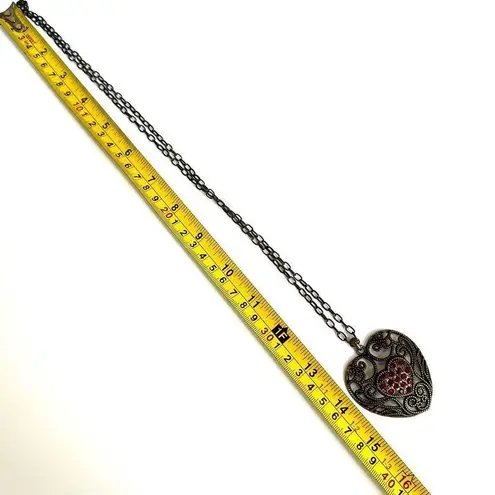 Brass tone red rhinestone heart pendant necklace