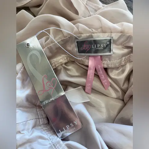 Lipsy London bell sleeve tan romper‎ size 6