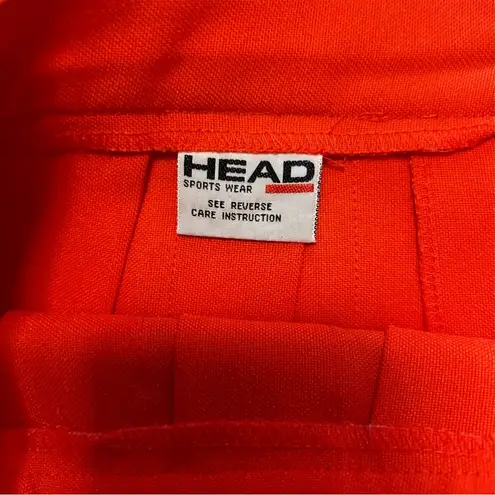 Head  orange pleated tennis skirt