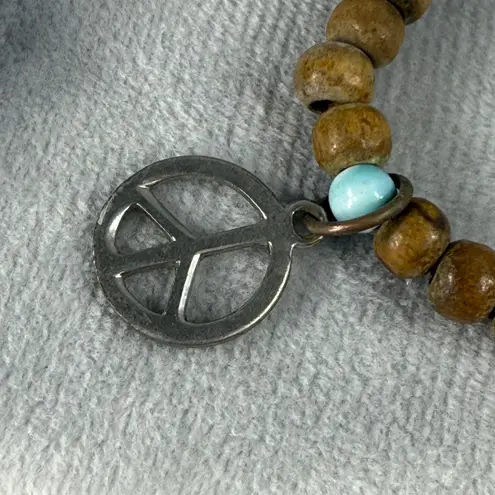 Set Of 3 Beaded Stretch Bracelets Red Blue & Natural Wood Beads Peace Sign Charm