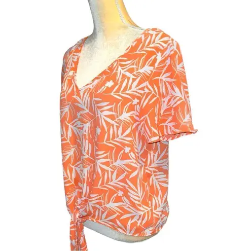 Nine Britton  cute new white tie front top with orange floral design.