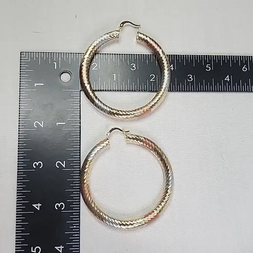 Gold Swirl Diamond Cut Tube Hoop Earrings