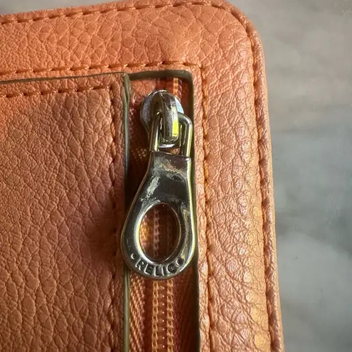 Relic pink peachy wallet paper money and coins