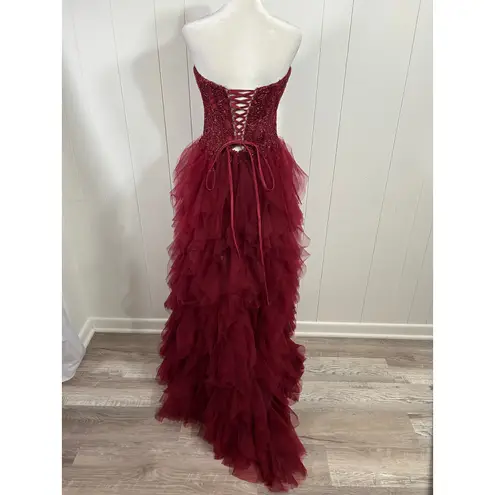 Prom Bay size 6 prom dress in the color wine. Corset with Lace up back & Ruffles Red