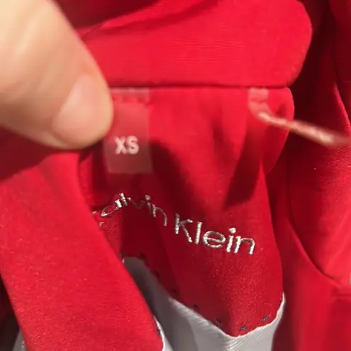 Calvin Klein  red button up trench coat