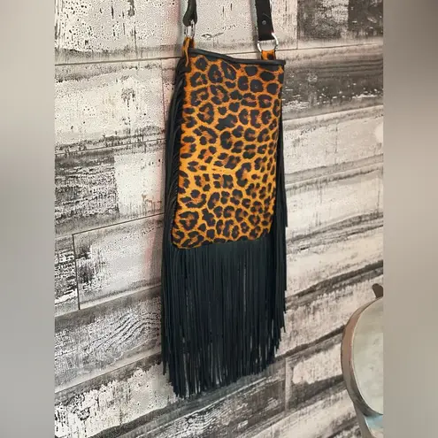 Leopard print with fringe crossbody purse with adj strap 10”x13” leather Brown
