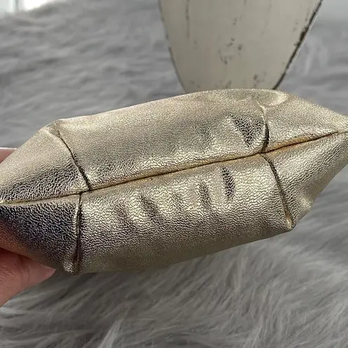 Vintage gold shimmering faux leather glam handbag with tassel. Gold