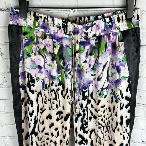 Bebe  Floral Animal print blend joggers with faux leather side pockets. Size M