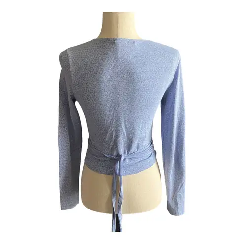 Brandy Melville Beautiful blue with tiny white flowers wrap top, long sleeves, has stretch, excellent condition, size medium Measurements: Bust: armpit to armpit 16 inches  Length: shoulder seam to bottom 17 inches