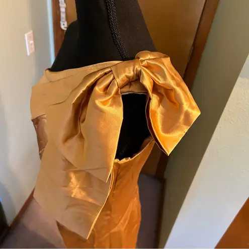 NWOT gold satin one shoulder prom dress with bow on shoulder back slit size 8