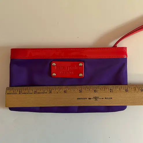Kate Spade  Chrissy wristlet wallet purple nylon with red patent trim and logo