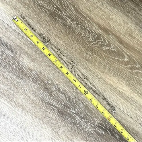 Long silver tone necklace with circles