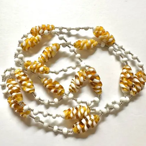 White and yellow swirl long beaded necklace
